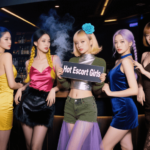 Five women in stylish dresses pose together. "Hot Escort Girls" sign is held in the center.