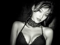 Glamorous woman with a choker, sultry gaze, possibly a KL escort or call girl.