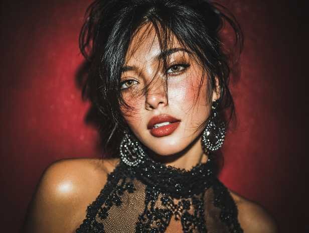 Glamorous woman with red lipstick and statement earrings in Kuala Lumpur.