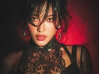 Striking woman with dark hair and lace top, possibly a KL escort or call girl.