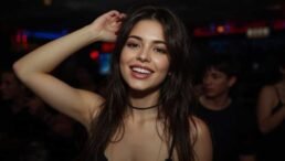 Smiling woman with long brown hair at a club
