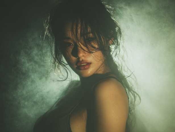 Sultry woman with wet hair and dewy skin. Kuala Lumpur escort.
