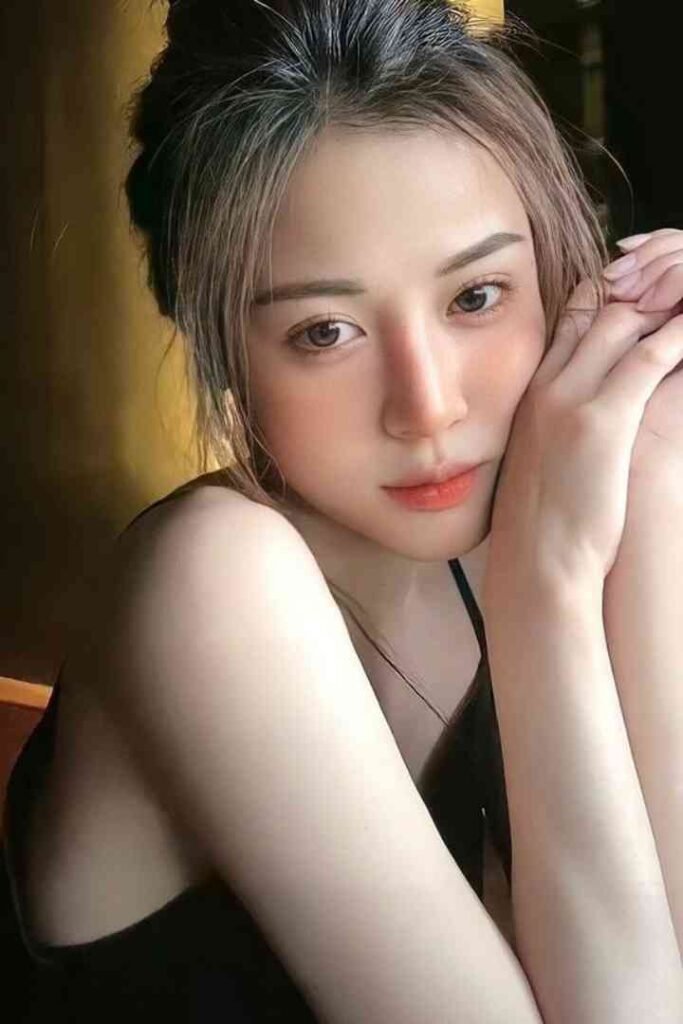 Young Malay woman with expressive eyes and soft makeup