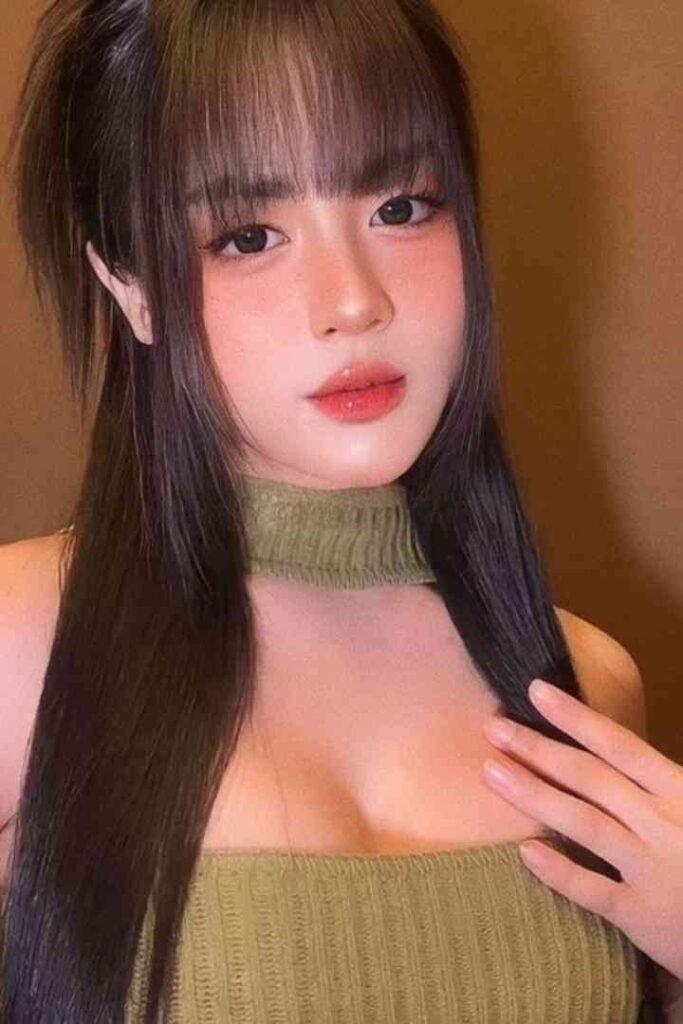 Tina, 23yo local Malay escort in KL with C cup, posing in green top