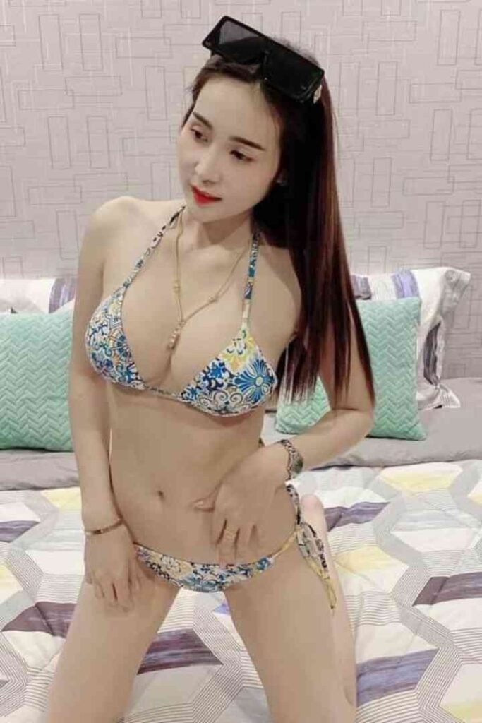 Amy, a 23-year-old Thai escort in KL, poses in a bikini.