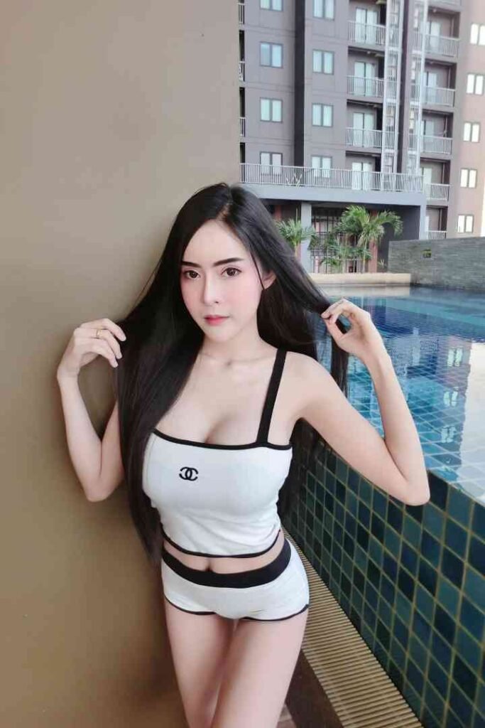 Hana Thailand escort, 164cm beauty, B cup, posing by a swimming pool