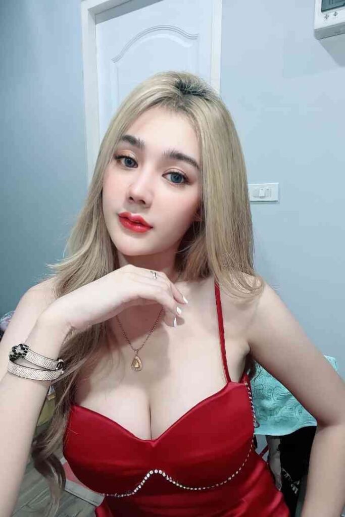 Young Thai woman with blonde hair and red dress in KL