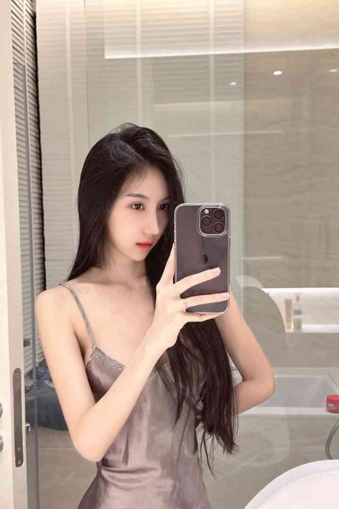 Kitty, 23yo Chinese escort KL, selfie in satin slip dress