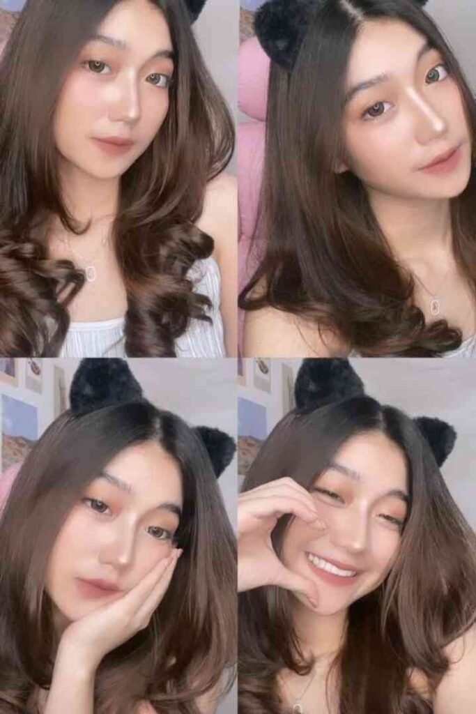 Young woman with brown hair and cat ears, smiling