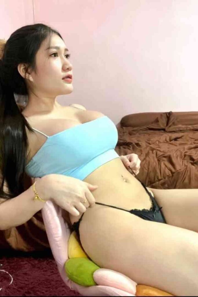 Young Thai woman in blue top and black underwear