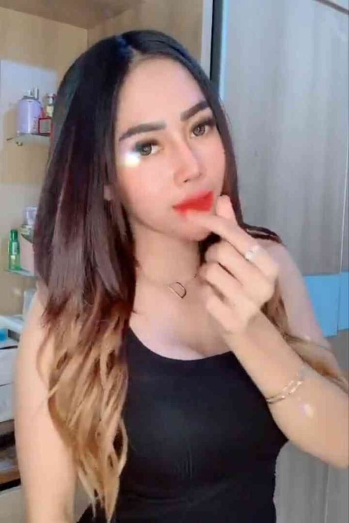 Young Malay woman with ombre hair and red lipstick, Sindy